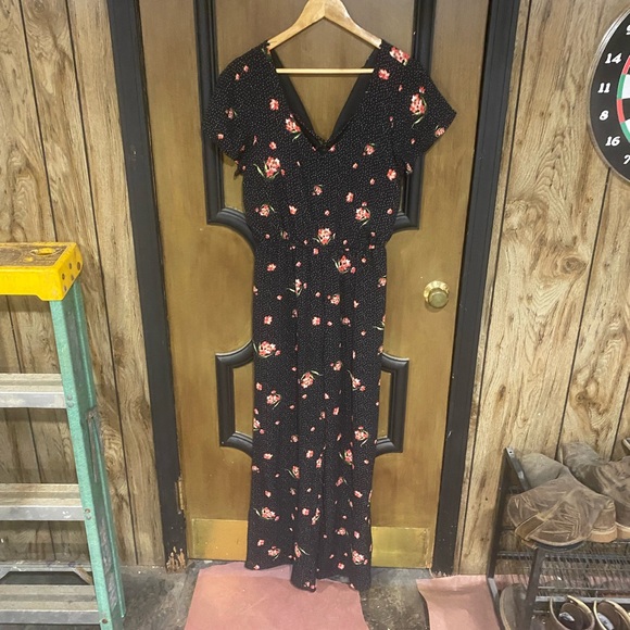 Black floral jumpsuit with white polkadots. Worn a handful of times. - Picture 1 of 4